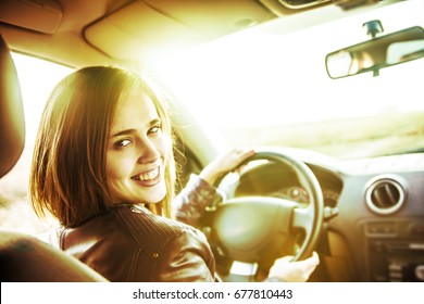 Woman In Car Indoor Keeps Wheel Turning Around Smiling Looking At Passengers In Back Seat Idea Taxi Driver Talking To Police Companion Companion Who Asks For Directions Right To Drive Documents Exam