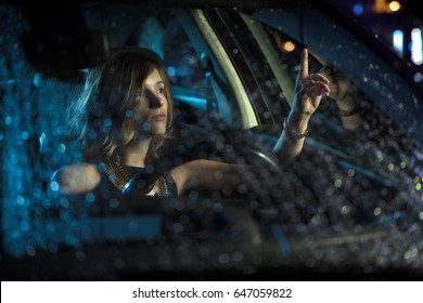 Woman In Car Night Light Sit Rain