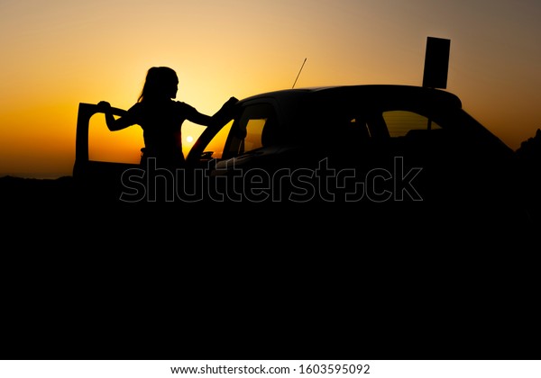 Woman and car the\
opposite of the sun