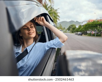 Woman, car, passenger seat a woman is seated in the passenger seat of a car, gazing out the window at the road ahead with her head slightly raised, capturing a sense of travel and contemplation - Powered by Shutterstock