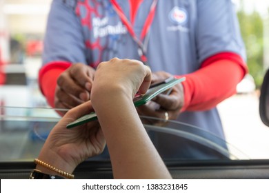 Woman In Car Paying Gasoline With Credit Card, Female Holding Debit Card Payment At Gas Station. Petrol Oil Loyalty Mileage Point Reward For Cash Money. Driver Sign For Paying Fuel With Credit Card.