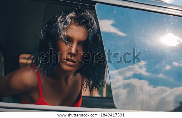 Woman in car. Sensual woman. Beauty photo. Fashion\
photo. \
