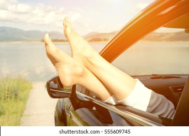 Woman in car. Summer vacation and travel, romantic road trip.