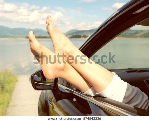 Woman in car. Summer vacation and travel, romantic\
road trip.