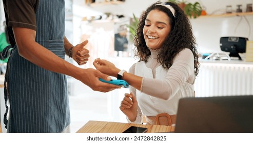 Woman, card machine and payment in coffee shop for trade, transaction and remote work on laptop. Female client, digital technology and pos in restaurant for business, sale and customer service - Powered by Shutterstock