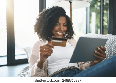 Woman, card and tablet and happy on couch, fintech and transaction for online shopping in home. Customer, internet payment and credit score app or banking, ecommerce and smile or purchase on sofa - Powered by Shutterstock