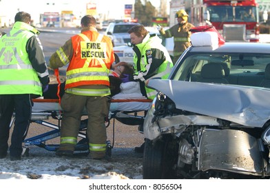 A Woman Is Cared For By Emergency Workers After A Motor Vehicle Accident In Edmonton,Alberta,Canada.