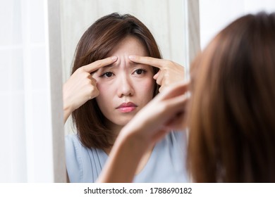 A woman cares about her wrinkles between her eyebrows. - Shutterstock ID 1788690182