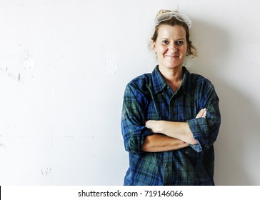 Woman Carpenter Working On A Wood