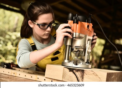 Woman Carpenter Working With Wood.