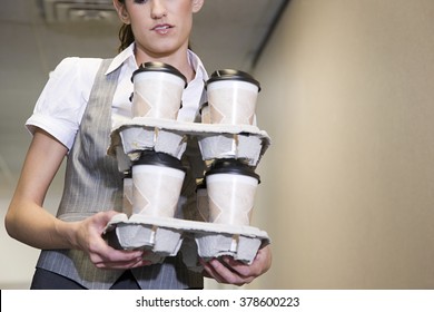 Woman Carrying Coffee Cups