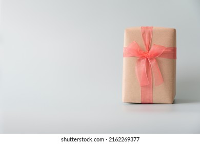 Woman Carrying Gift Paper Box Tie Cute Ribbon For Special Occasion. Delivery Sending Present To Someone Special To Thank Or Surprise.