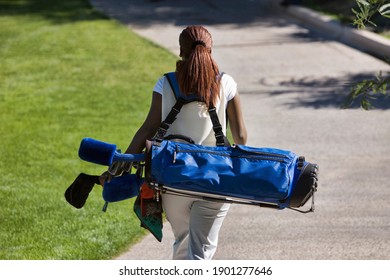 Woman Carrying Golf Club Bag