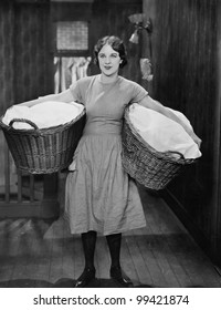 Woman carrying laundry baskets