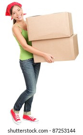 Woman carrying moving boxes. Young woman moving house to new home holding cardboard boxes isolated on white background standing in full length.