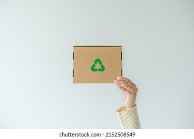 Woman Carrying Paper Box Concept Of Reuse, Recycling Object To Zero Waste. Concept Of Sustainability Using Of Recycled Paper Cardboard Box To Save The Global Warming.