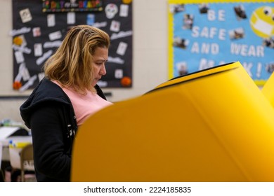 A Woman Casts Her Ballot At A Voting Station Tuesday, November 8, 2022 In Los Angeles. 