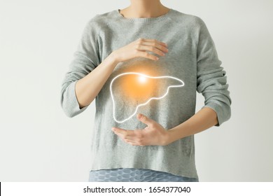 Woman in casual grey clothes suffering from indigestion pain, highlighted vector visualisation of liver