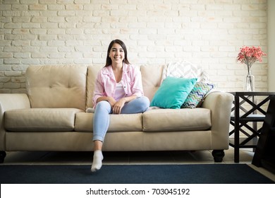 Woman in a casual outfit chilling alone in her apartment enjoying her independence 