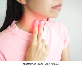 A Woman Catch At Lump On Her Neck. Closeup Photo, Blurred.