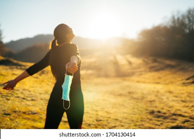 Woman celebrating without mask.Concept of defeating illness.Recovered from coronavirus.Cured disease emotional patient.Covid-19 virus outbreak problems solved.Immunity to virus.Stress free.Breathing - Shutterstock ID 1704130414