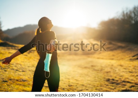 Woman celebrating without mask.Concept of defeating illness.Recovered from coronavirus.Cured disease emotional patient.Covid-19 virus outbreak problems solved.Immunity to virus.Stress free.Breathing Foto stock © 
