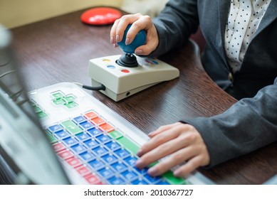 Woman With Cerebral Palsy Works On A Specialized Computer.