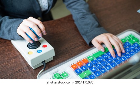 Woman With Cerebral Palsy Works On A Specialized Computer.