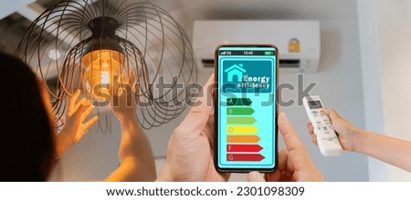 Woman change a new electric bulb, open air conditioning 26 degrees make a home more energy efficient. Home appliance energy efficient. Household equipment and energy class chart. Power saving concept.