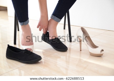 woman change shoes concept