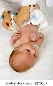 woman-changing-babys-nappy-260nw-2270557.jpg
