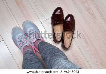 Woman changing shoes before training.