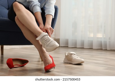 Woman Changing Shoes In Room, Closeup View