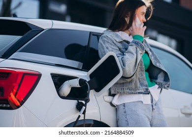 Woman Charging Her Electric Car Charging Stock Photo Shutterstock