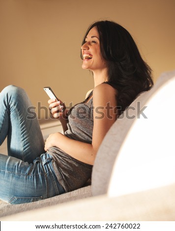 Woman chatting over smart phone.