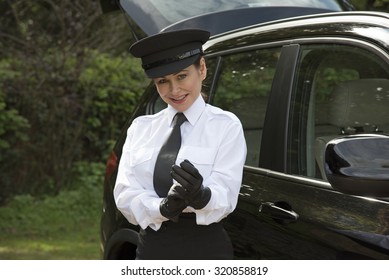 Woman Chauffeur Putting On Her Uniform Black Leather Gloves