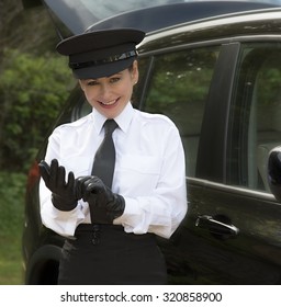 Woman Chauffeur Putting On Her Uniform Black Leather Gloves