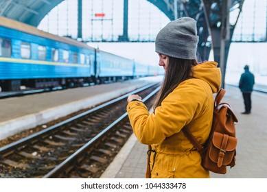 Woman Check Time. Waiting For Train On Railway Station. Travel Concept