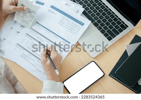 Woman checking credit card billing information