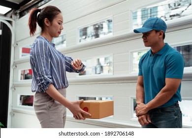 Woman Checking Delivery Time On Watch. Late Delivery For Package.