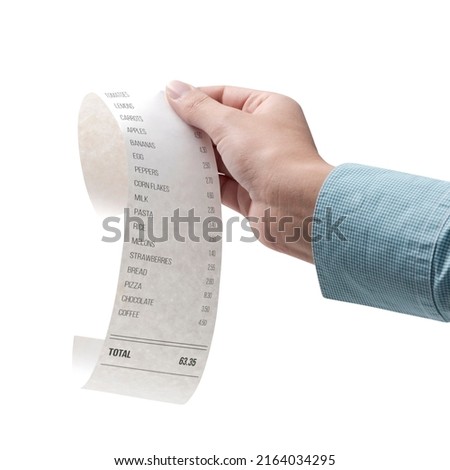Woman checking a grocery receipt Isolated on white background