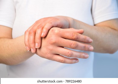 Woman Checking The Hand With Very Dry Skin And Deep Cracks