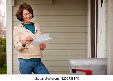 A Woman Checking Her Mailbox.