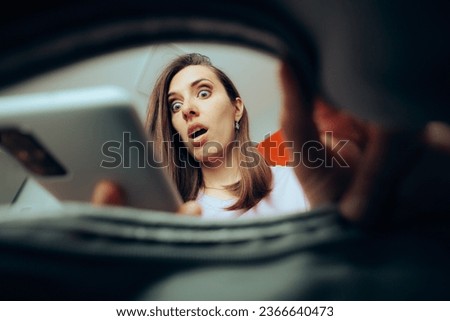 
Woman Checking her Phone Ringing in her Purse. Girl finding her phone in a handbag checking notifications in shock
