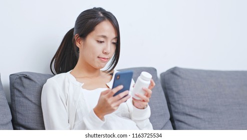 Woman checking the ingredient and bottle of drug  - Powered by Shutterstock