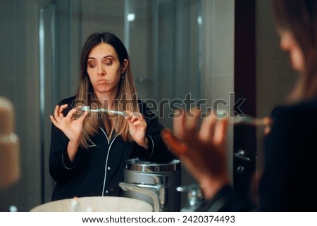 
Woman Checking Old Toothbrush About to Throw it Away. Disappointed girl buying a cheap brush for dental hygiene 
