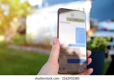 Woman  Is Checking Text Messages  Holding Smartphone Outside.