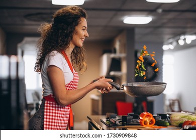 Woman Chef Cooking Vegetables In Pan