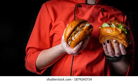 Woman Chef Holding Two Burger In Hand