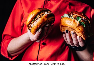 Woman Chef Holding Two Burger In Hand